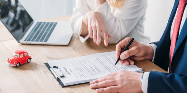 Two people reviewing a document